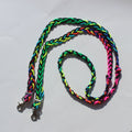 Braided nylon barrel reins with metal clasp hardware, shown in a vibrant multicolor pattern of neon green, pink, orange, yellow, and black