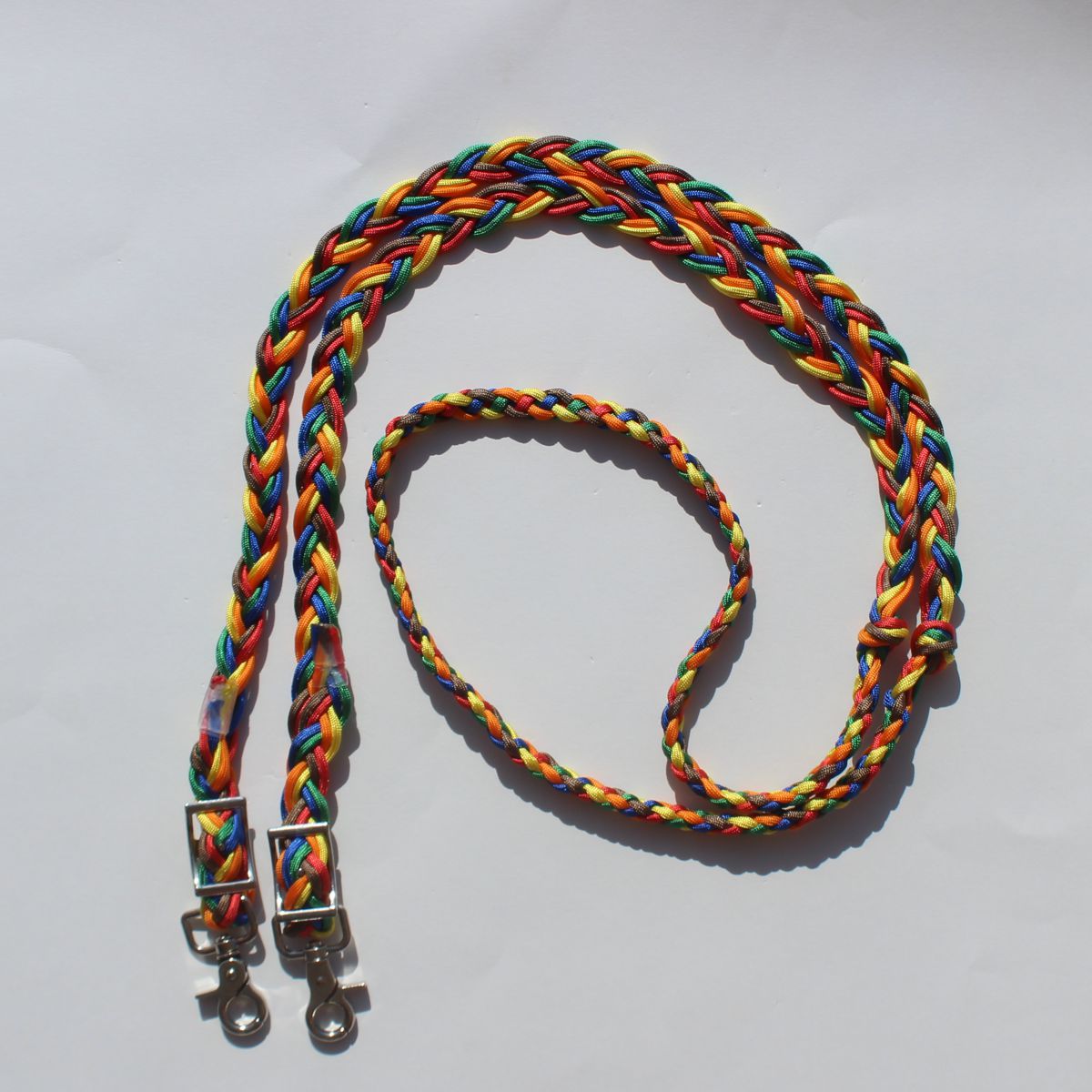 Hand braided multicolor barrel reins with silver metal snap hooks, 