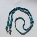 Braided barrel reins in turquoise blue and brown, featuring silver metal snap hooks at both ends