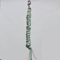 A handmade rainbow braided horse lead rope with a silver metal clasp