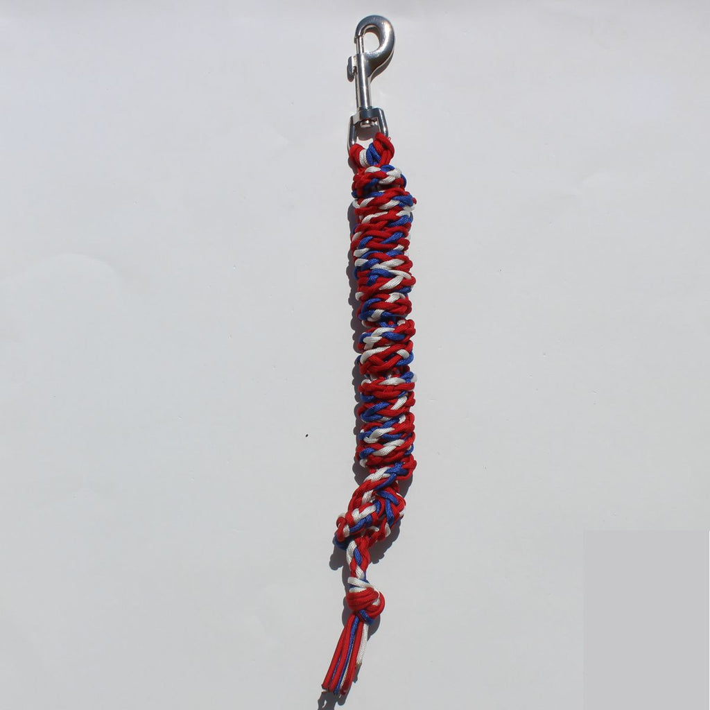 A red, white, and blue braided lead rope  with a silver metal snap hook at the top, 