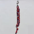 A red, white, and blue braided lead rope  with a silver metal snap hook at the top, 