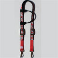 A red and black horse headstall with a chicken nugget pattern, featuring metal buckles