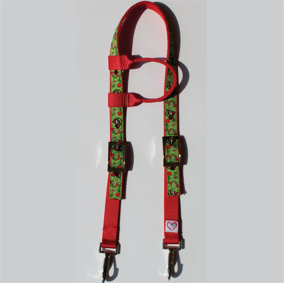 A red horse headstall with grump webbing and metal hardware.