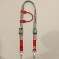 A horse headstall with a colorful comic book print strap and bright red webbing, 