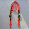 Bright orange safety horse headstall with yellow and black caution tape printed straps and silver metal clips