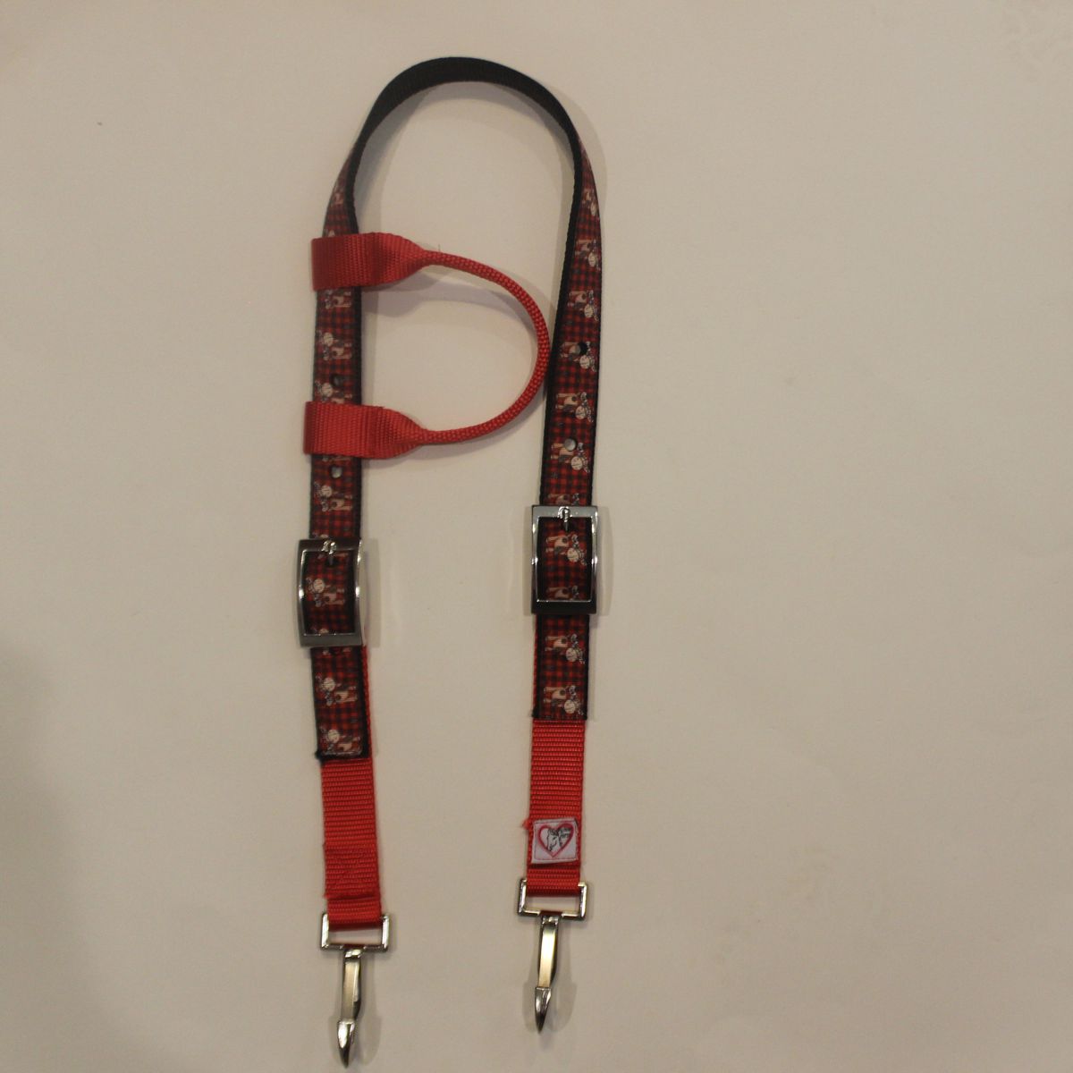 Horse headstall with plaid background and reindeer