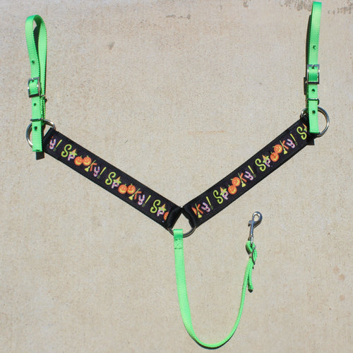 Horse halter with green straps and 'Happy Halloween' design on a beige background