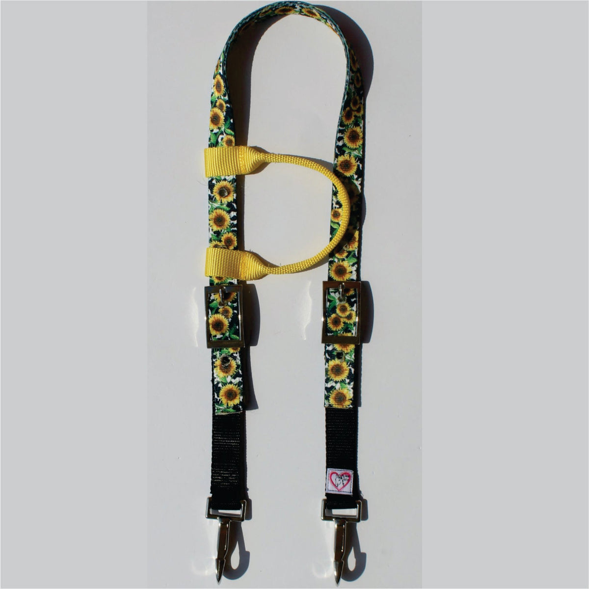 A one ear horse headstall featuring a green and yellow sunflower pattern, a yellow webbing loop