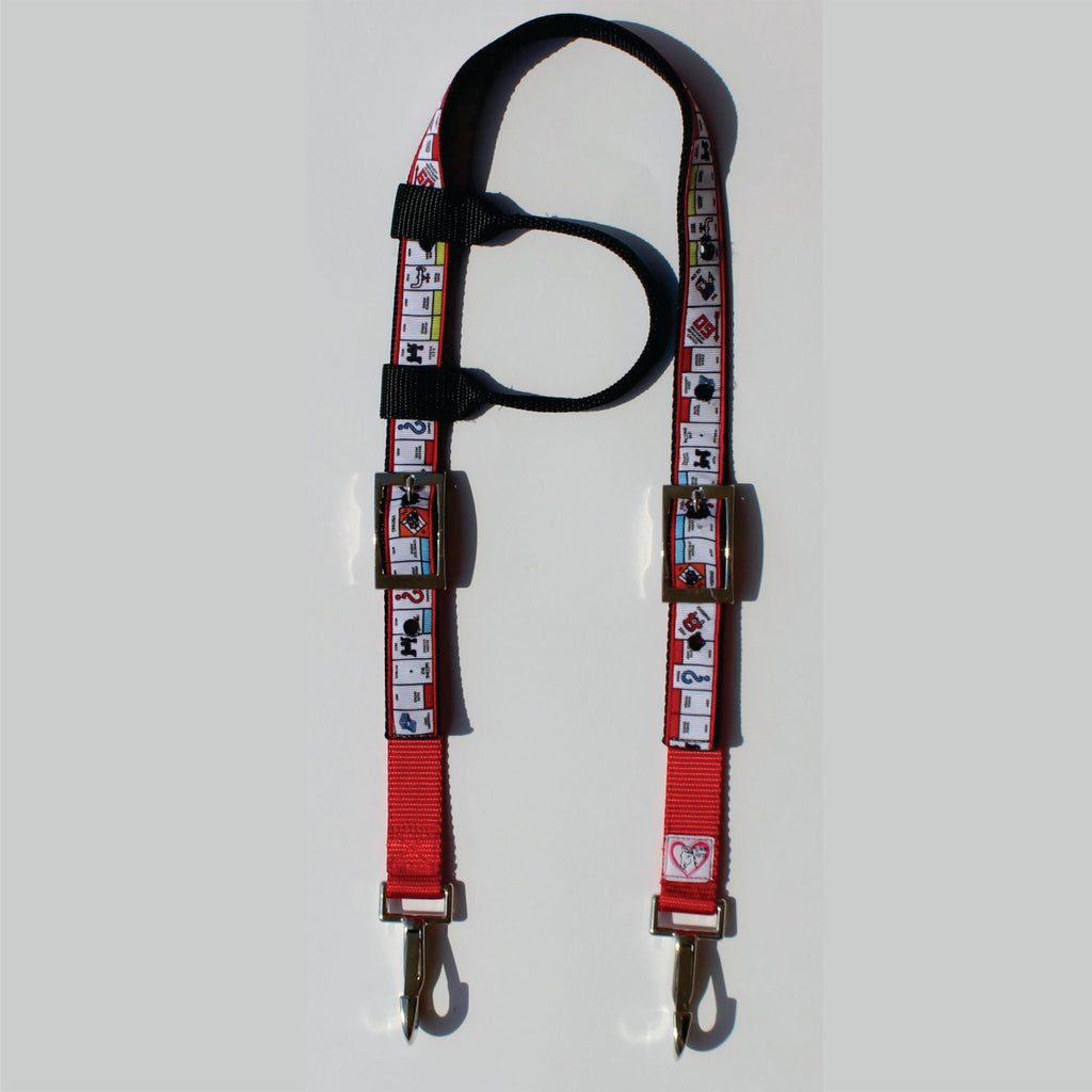 A red and black horse headstall with a printed pattern of playing cards, featuring metal hardware 