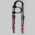 A red and black horse headstall with a printed pattern of playing cards, featuring metal hardware 