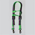 A horse headstall with bright green webbing and purple halloween straps, featuring metal buckles and clips, 