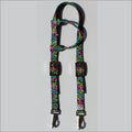 A neon leopard print horse headstall with colorful straps, metal buckles, and 